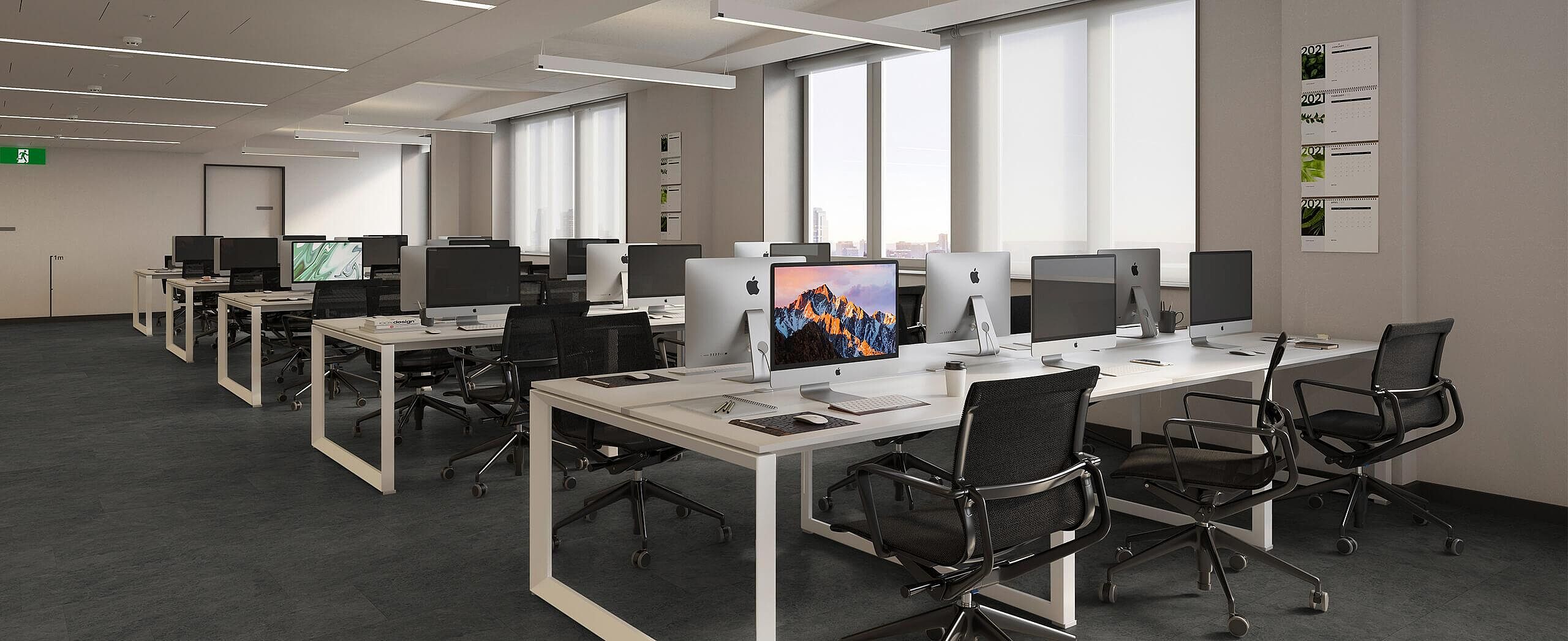  Modern open-plan office with recycled elastic flooring in a dark, subtly textured look.