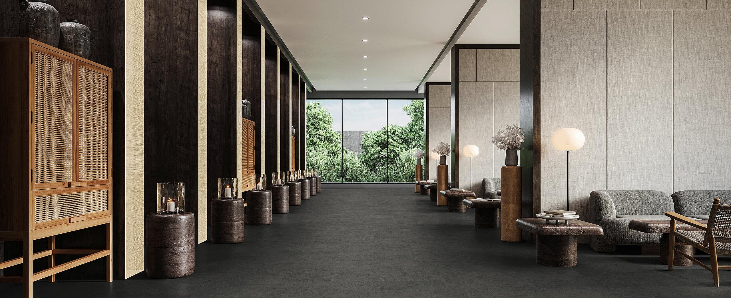 Elegant lounge corridor with recycled elastic flooring in dark stone-look.